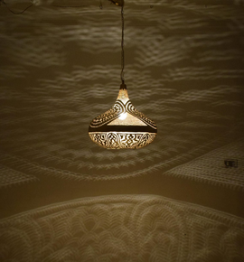 Moroccan brass ceiling fixture for living rooms, suspended as a pendant lamp with artisan craftsmanship and boho-inspired design.
